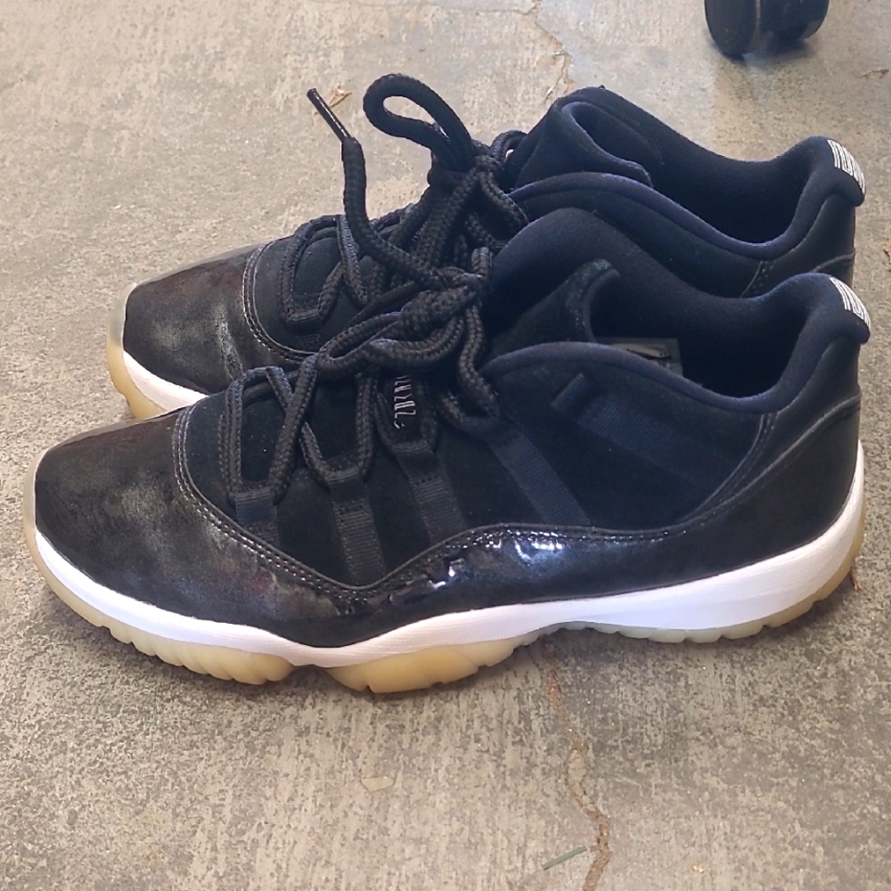 Jordan 11 Retro Low Barons Black and White Athletic Sneakers